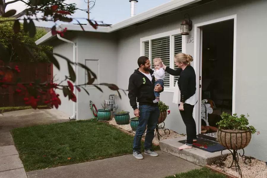 Romulo Melo at home with his family.